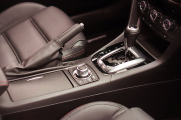Obraz na płótnie Canvas Black interior inside car - gear and shift lever
