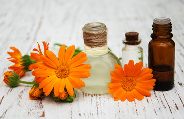 calendula oil in a glass bottles