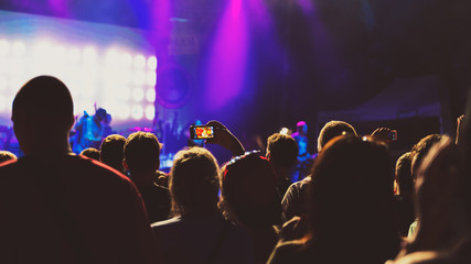 Fototapeta na wymiar Friends taking a selfie at summer festival concert