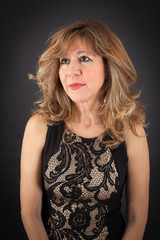 Naklejka premium Beautiful woman doing different expressions in different sets of clothes: thinking