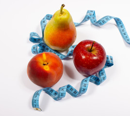 Apple, pear, peach and tape measure, diet concept