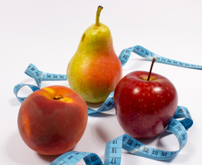 Apple, pear, peach and tape measure, diet concept