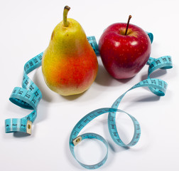 Apple, pear and tape measure, diet concept