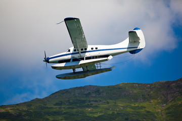 Single engined seaplane coming in to land in Alaska