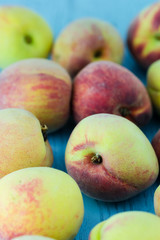 group of fresh peaches on wood background