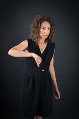 Naklejka premium Beautiful woman doing different expressions in different sets of clothes: thumbs down