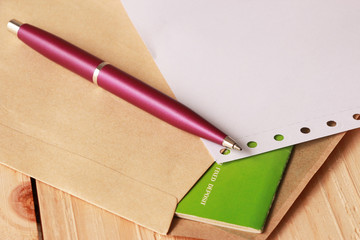 Violet Pen on Document Holder with Old Green Fixed Deposit Book