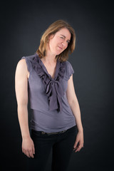 Fototapeta premium Beautiful woman doing different expressions in different sets of clothes: blinking