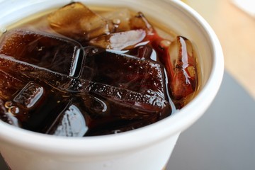 Cola with ice cubes