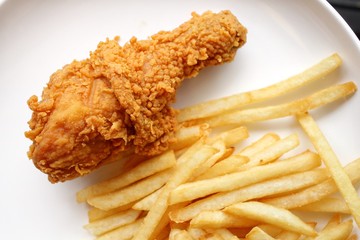 Fried chicken leg with french fries