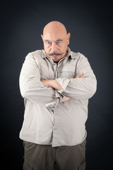 Handsome man doing different expressions in different sets of clothes: arms crossed