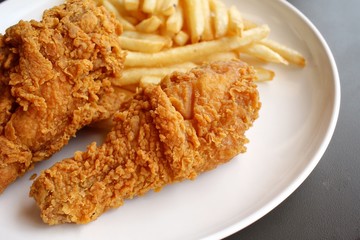 Fried chicken leg with french fries