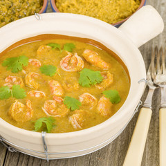 Moqueca de Camarao - Brazilian prawns in coconut milk and dende oil. Served with caruru, vatapa, farofa and rice. Food from Bahia.