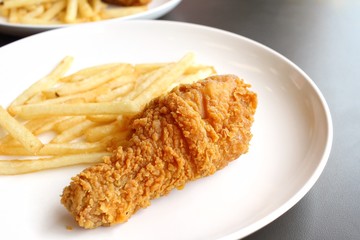 Fried chicken leg with french fries