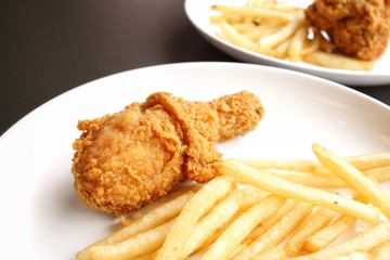 Fried chicken leg with french fries