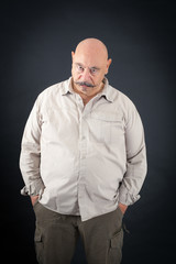 Obraz premium Handsome man doing different expressions in different sets of clothes: angry