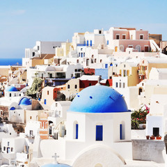 Fototapeta na wymiar Classic Santorini scene with famous blue dome churches, Greece