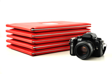 the camera on the background of photo books. graduation photo.