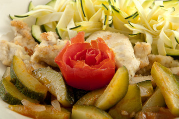 strips of roasted turkey with tomato and zucchini