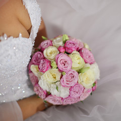 Sexy woman hands holding beautiful wedding bouquet