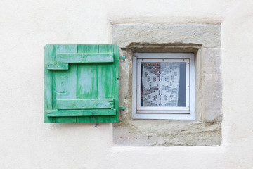 Small window and wooden shutter