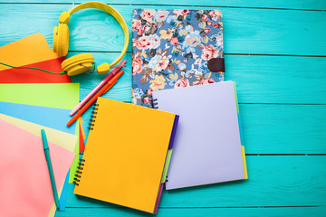 Workspace on blue wooden background. Education accessories
