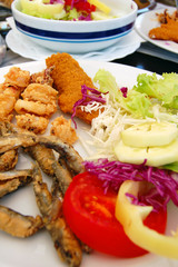 deep fried seafood with fresh salad