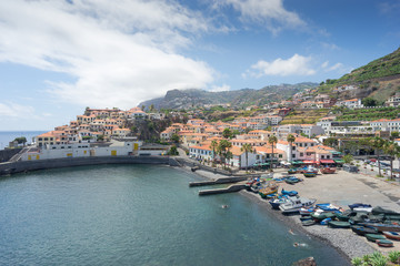 Fototapeta na wymiar Camara de Lobos, Portugal - July 18, 2015: Harbor of Camara de Lobos near Funchal, Madeira Island.