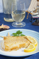 floured cod cooked in a pan