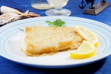 floured cod cooked in a pan
