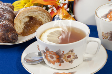 Tea with lemon croissant