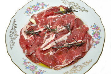 Slices of veal with garlic and rosemary