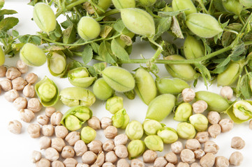 Burlap sack with chickpeas spilling out over a white background