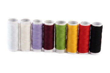spools of sewing thread in various colors