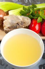 beef broth with a piece of veal