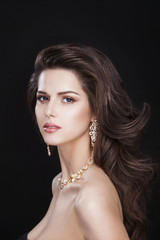 portrait of a beautiful brunette girl with luxury accessories