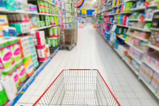 shopping cart in supermarket blurred Supermarket interior
