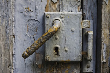 Old lock on a wooden door