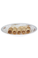 Tong Muan Rolled Wafer Thailand at the dish on white background.
