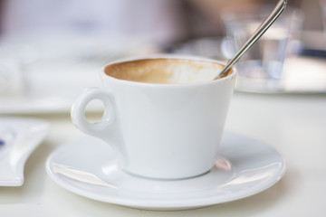 cappuccino in white cup in restaurant