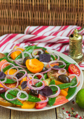 Salad of yellow and red tomatoes with green peas