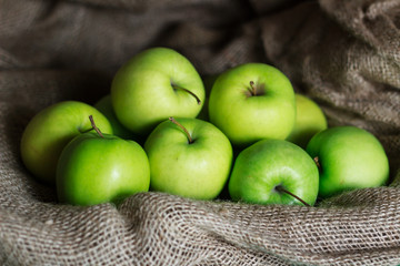Green apples on brown suck