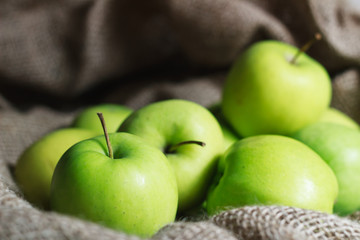 Green apples on brown suck