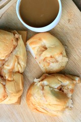 tasty coconut bread and hot coffee