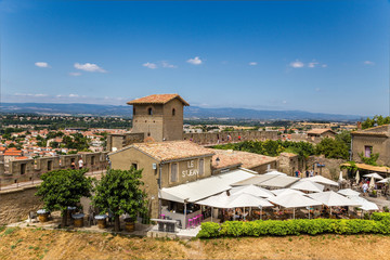 Obraz premium Carcassonne, France. Summer restaurant in the upper town on the background of the fortifications