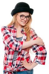 Young teenage girl in black hat, glasses and colorful clothes isolated on white background