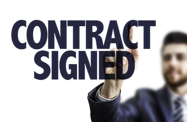 Business man pointing the text: Contract Signed