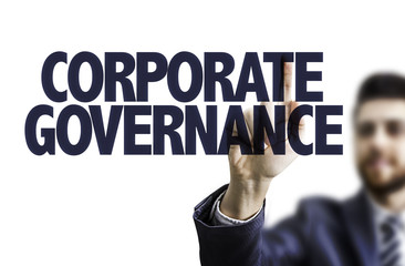 Business man pointing the text: Corporate Governance