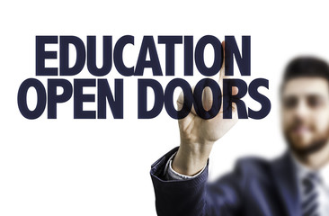 Business man pointing the text: Education Open Doors