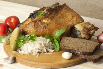 Roasted pork leg served with sauerkraut